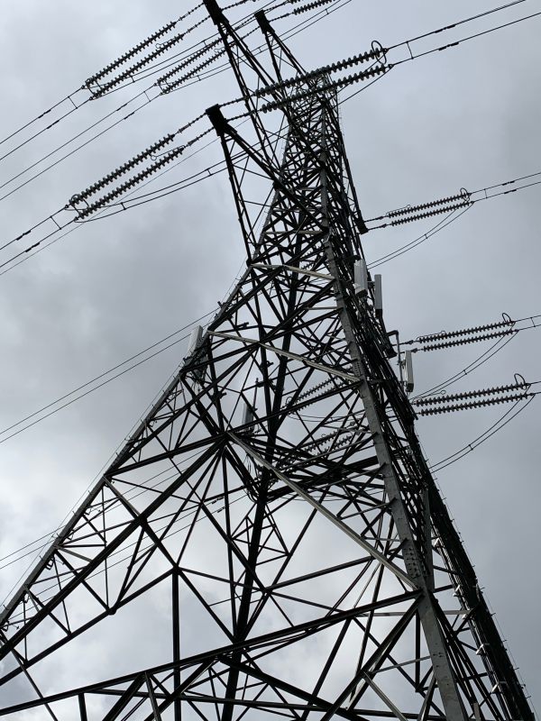 Looking up a pylon carrying High Voltage Power for the National Grid.