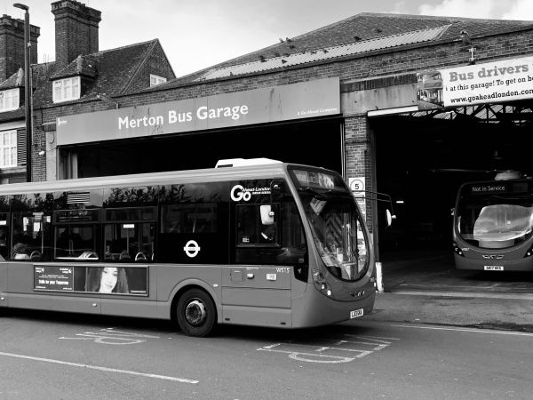 Merton Bus Garage, with a Wrightbus Streetlite outside and another parked inside.