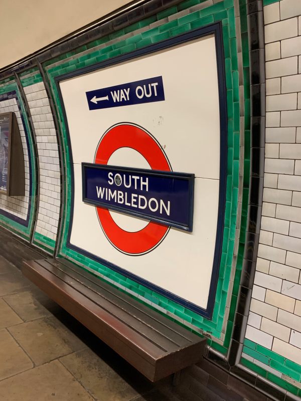 South Wimbledon Roundel and Way Out sign in ornate Green& White tiled frame, with original wooden bench.
