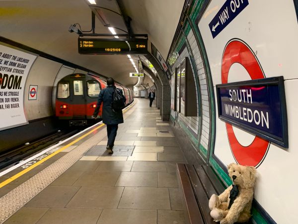 Bertie sat on a bench on the platform at South Wimbledon Station.