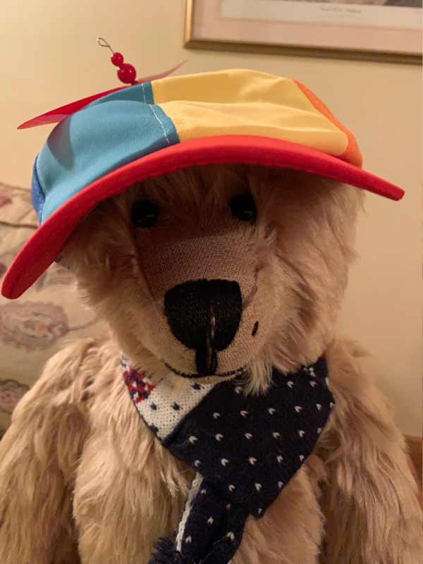 Bertie wearing a bright, multi-coloured cap.