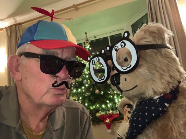 Bertie wearing silly black & white glasses, Bobby wearing a bright, multi-coloured cap with a rotor blade on top, dark sunglasses and a false plastic moustache!