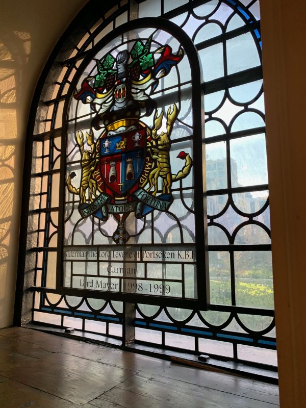 Stained glass window in St Botolphs dedicated to Alderman the Lord Levene of Portsoken KBE, Carman, Lord Mayor 1998-1999.