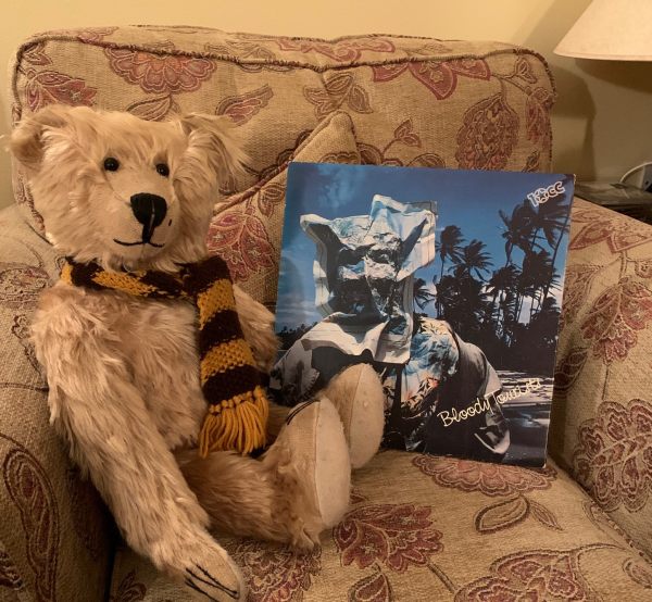 Bertie sat in a comfy armchair alongside the album sleeve of 'Bloody Tourists'.