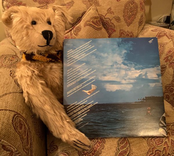 Bertie sat in a comfy armchair alongside the album sleeve back cover of 'Bloody Tourists'.