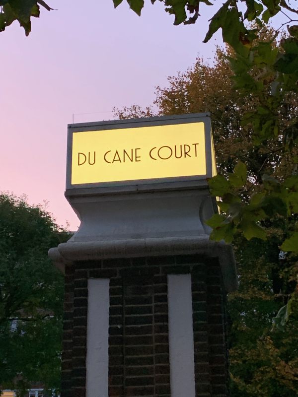 Illuminated gatepost sign "Du Cane Court".
