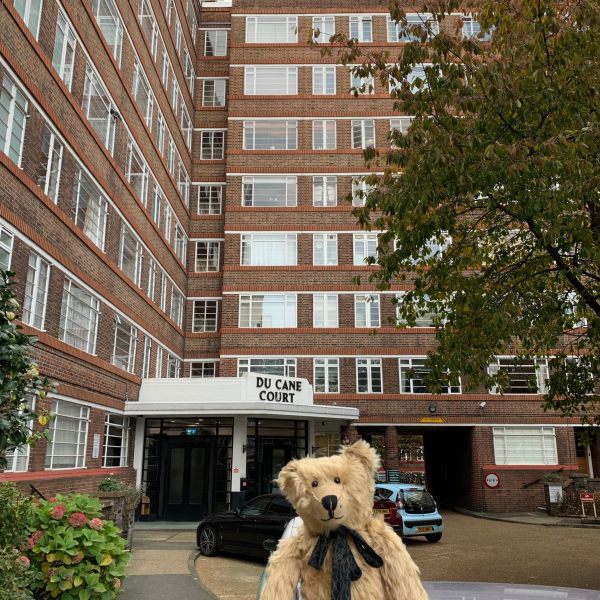 Bertie in front of one of the entrances to Du Cane Court.