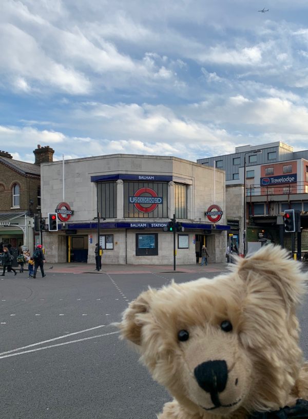 A break from our walking. Bertie poses outside Balham station.