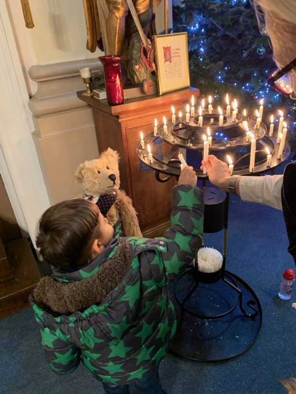 Bertie looking on as remembrance candles are lit.