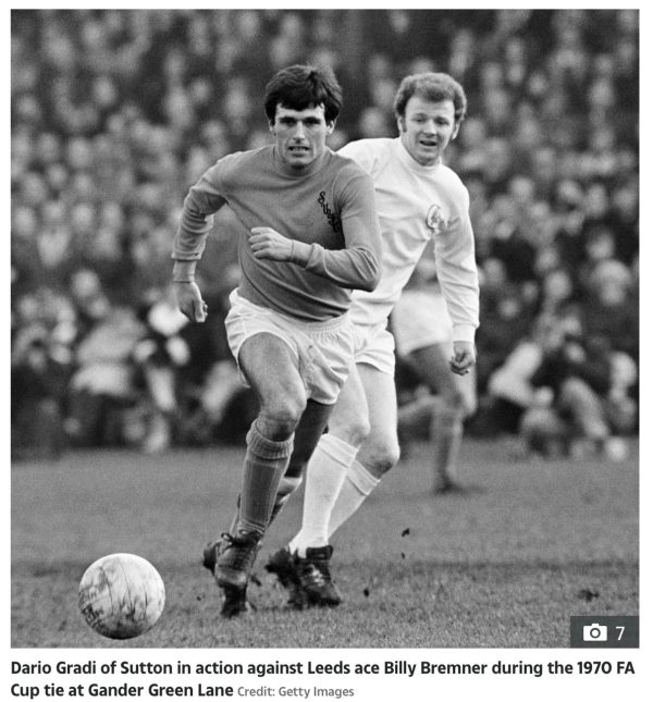 Dario Gradie of Sutton United in action against Leeds Ace Billy Bremner during the 1970 FA Cup tie at Gander Green Lane. Credit Getty Images.