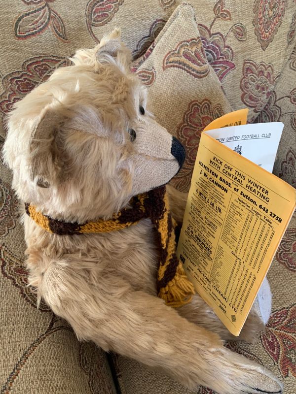 Bertie reading the programme - and an advert for central heating!