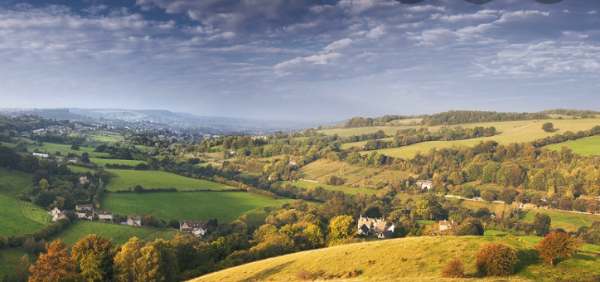 A panoramic view from Swift's Hill. Slad, Gloucestershire. Looking towards Stroud, the Severn estuary and the mountains of Wales beyond.