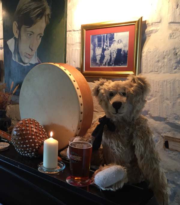 Lighting a candle for Diddley: Bertie at Laurie Lee's bar in the Woolpack at Slad.