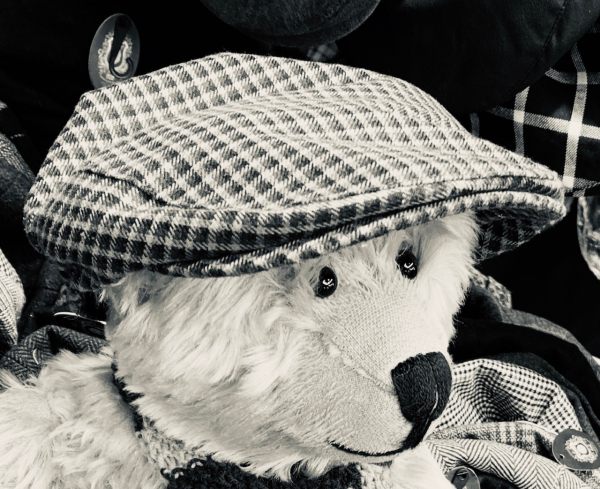 A Black & White photograph of Bertie wearing Bobby's cap creating a wartime effect.