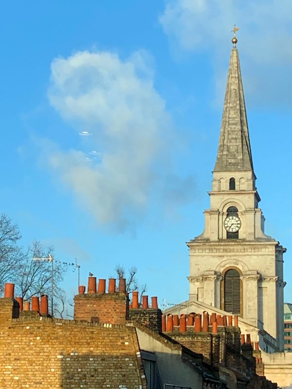 The chimney pots of Spitalfields. The magnificent Christ Church towering above.