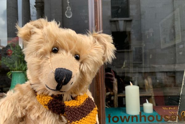 Bertie, wearing his Sutton United scarf outside The Townhouse, Fournier Street.