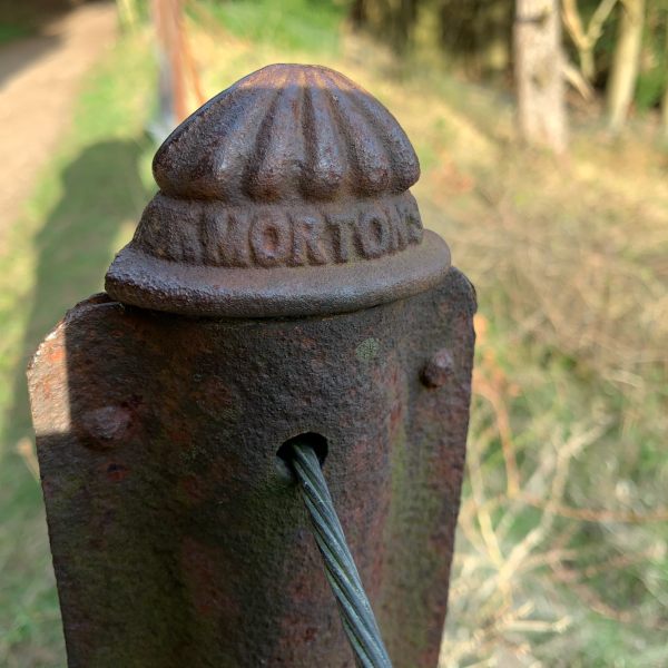 Cast iron post of the historic fencing dating back to 1860. Made by Morton of Liverpool, whose name is cast into the top of the post.