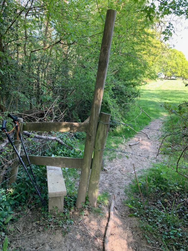 A style on the pathway, with a good tall pole alongside for support.