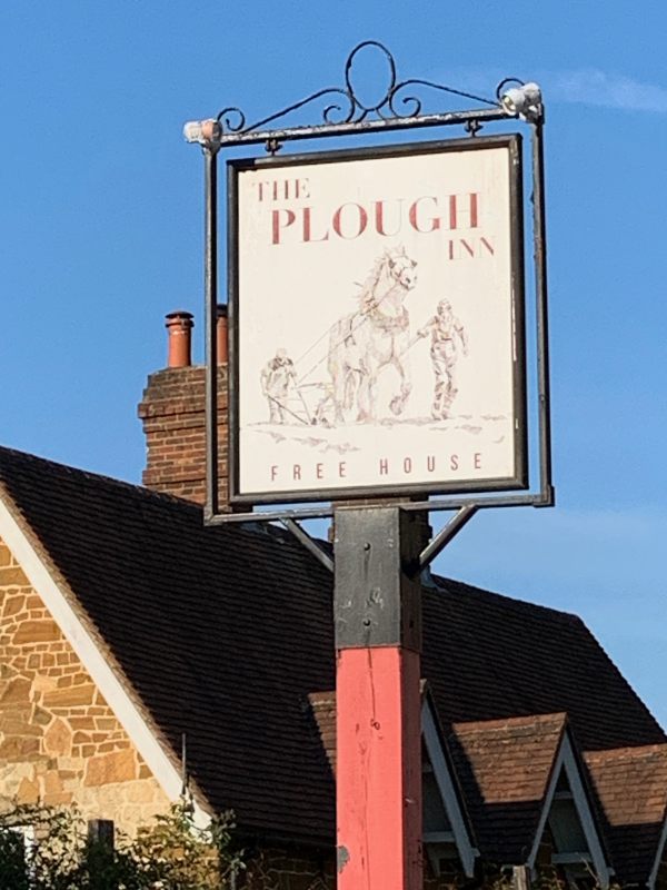 Sign for the Plough Inn. Free House.
