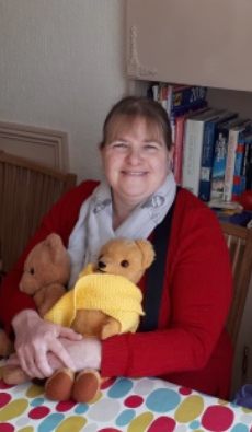 Carol sat at the table with Eamonn (wearing his new scarf) and Henry bear.