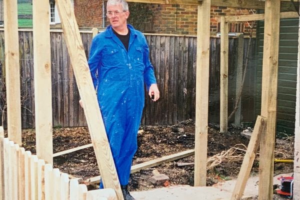 Bobby in his boiler suit building the pergola.