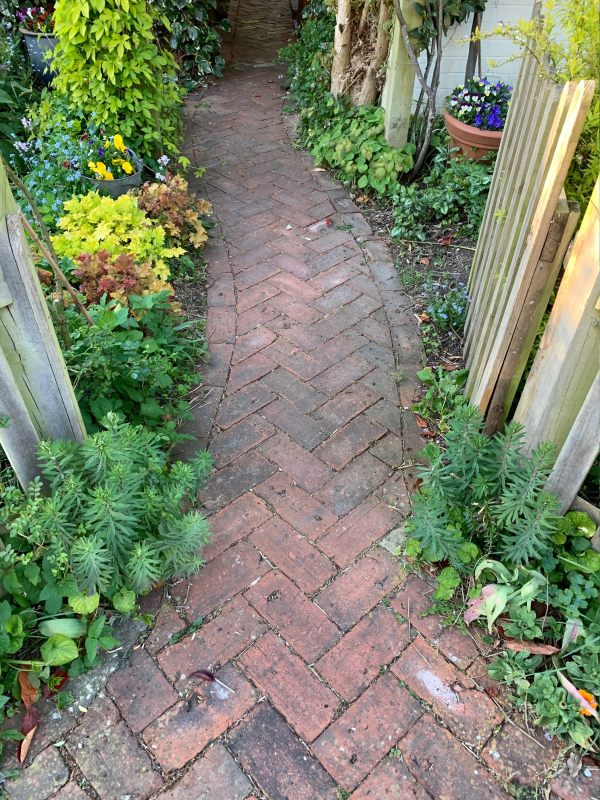 The curved herringbone footpath.