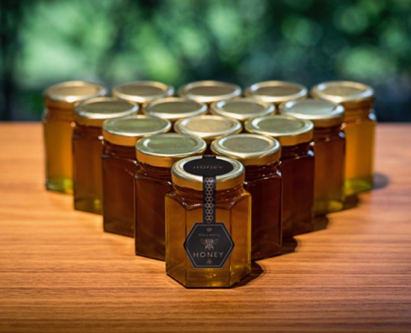 Jars of Rolls-Royce honey, laid out in a triangle.