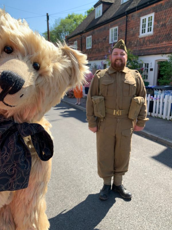 Man dressed up as a soldier, with Bertie photobombing the picture!