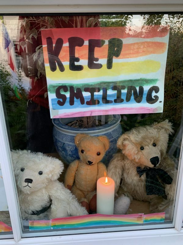 Bertie, Eamonn & Trevor in the window with a candle lit for Diddley.