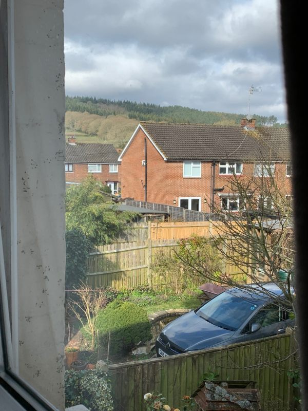 Looking out of the upstairs window in Laurel Cottage towards Redlands Forest.