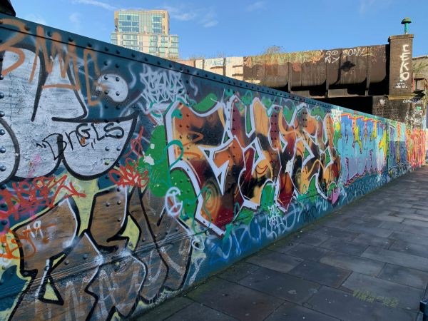 A graffti covered wall in Brick Lane.