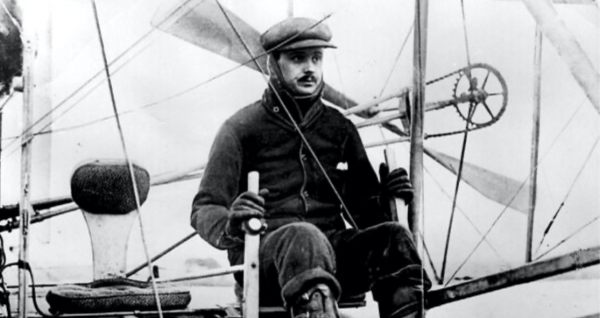 Charles Rolls piloting his biplane across the English Channel.