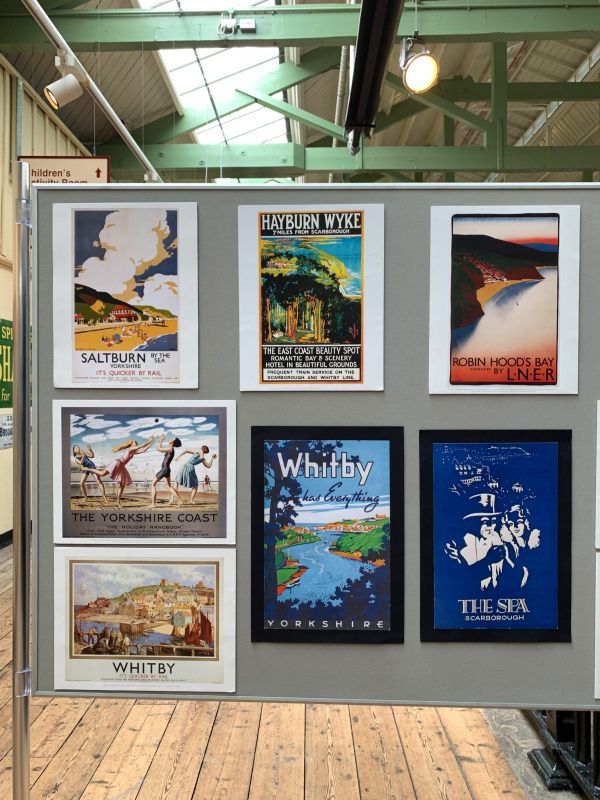 A selection of old railway advert posters.