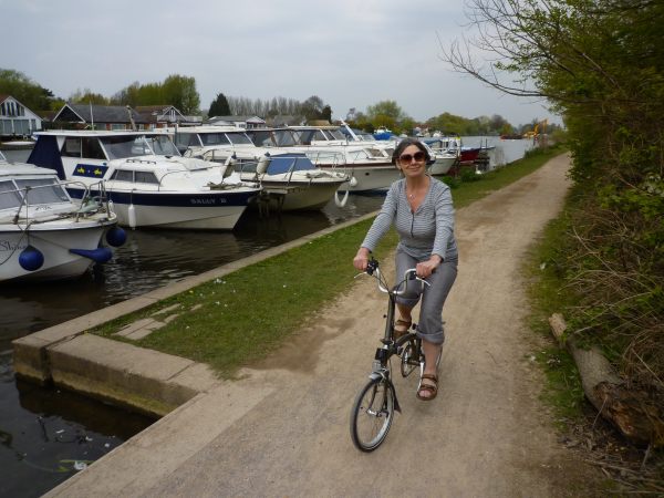 Diddley on her Brompton cycling along the Thames.