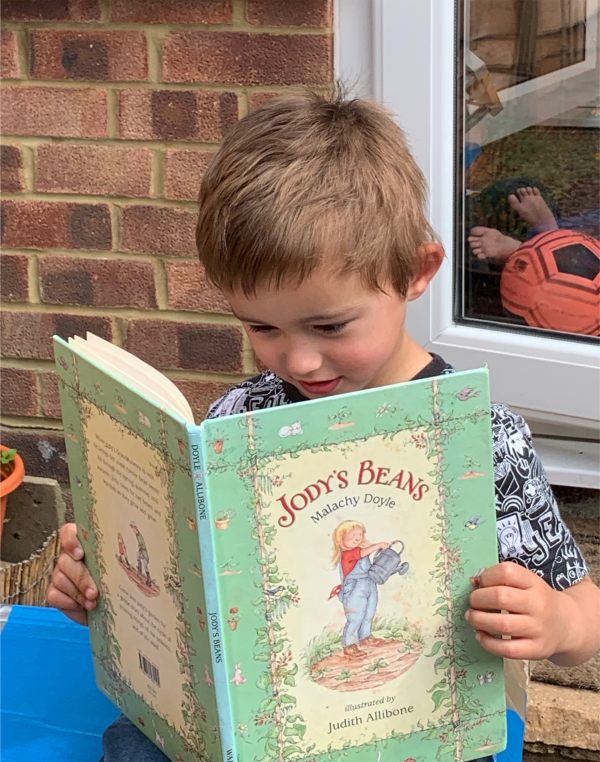 Little Jay. Jasmine's son reading Jody's Beans.