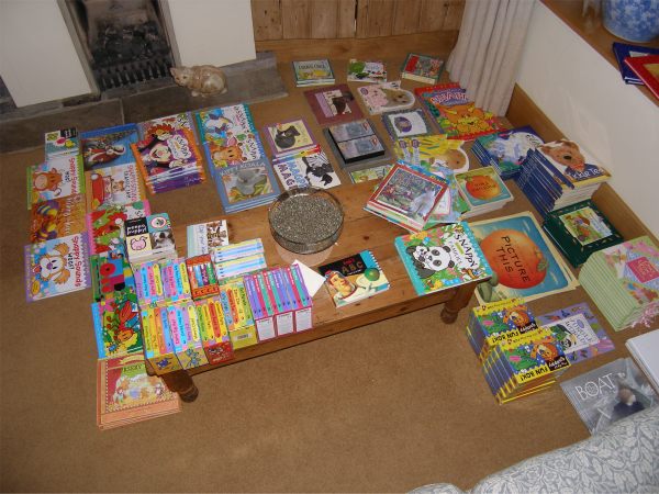 Sorting out dozens of brand new children's books.