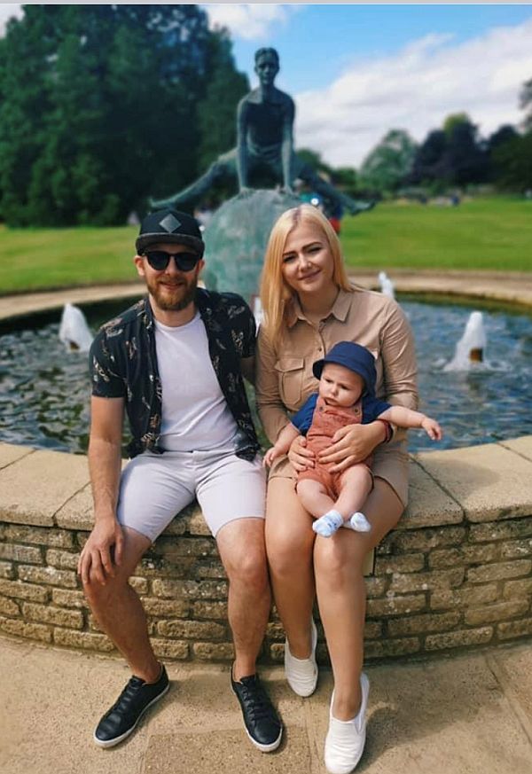 James, Amy May and Arno in front of a fountain.