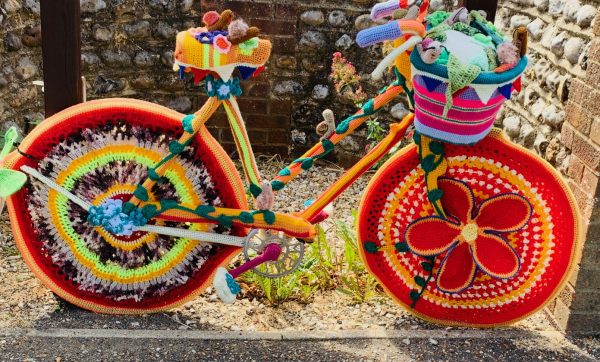 Yarnbomb Sisters - brightly coloured knitted ladies' bicycle.