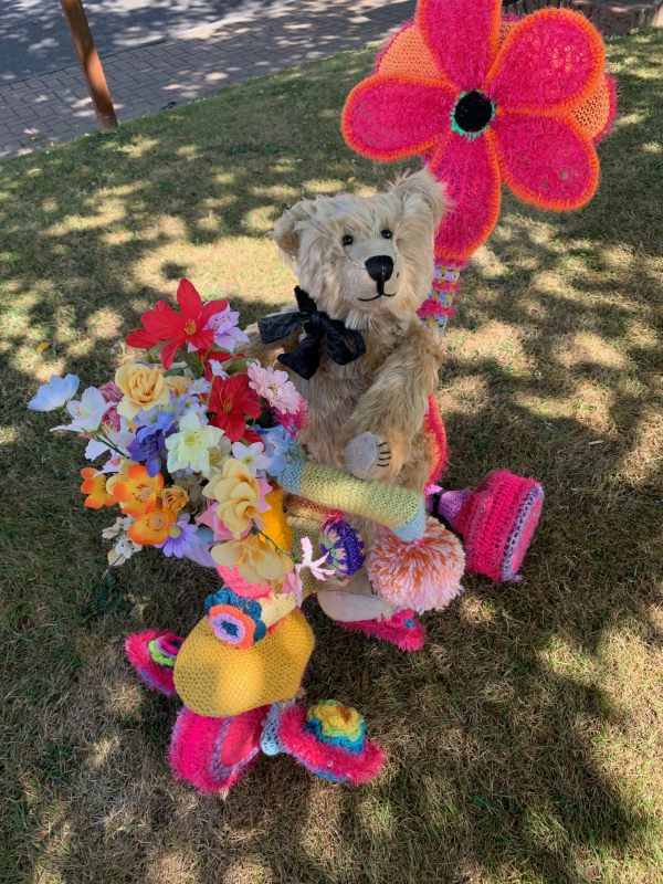 Yarnbomb Sisters - Bertie sat on the knitted toddlers' tricycle