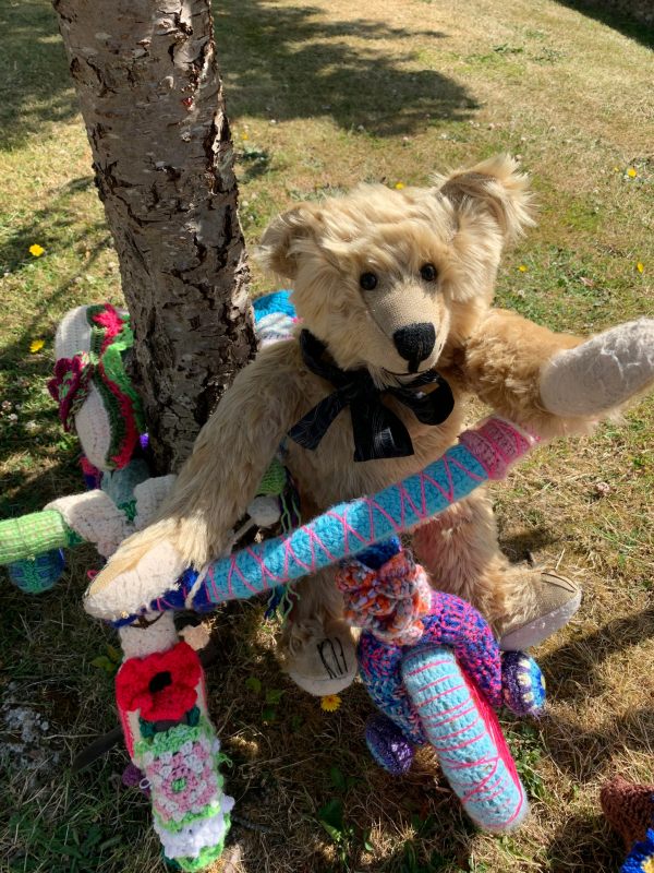 Yarnbomb Sisters - Bertie sat on the knitted toddlers' tricycle