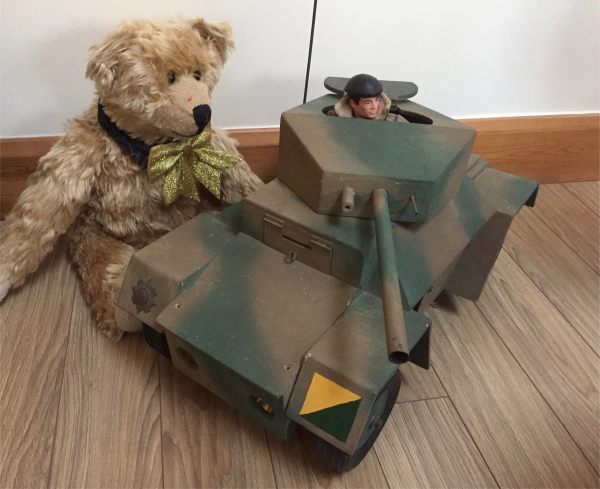 Bertie looking at Bobby's home made Action Man Armoured Car.