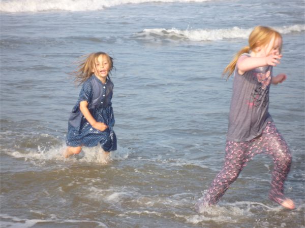 Ayla and Layla playing in the sea at Whitby.