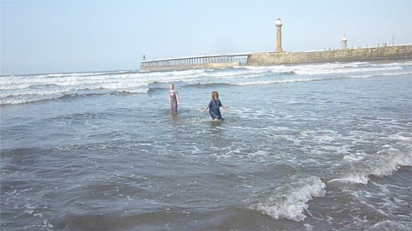 Ayla and Layla playing in the sea at Whitby.