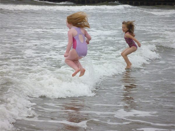 Ayla and Layla playing in the sea at Whitby.