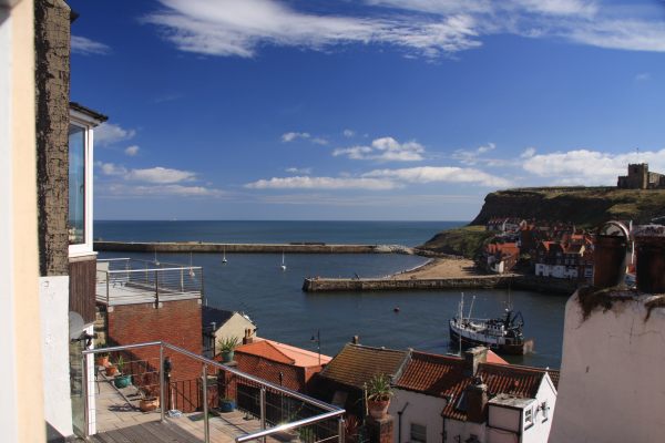 Morning has broken on a glorious day. Here is the view of Whitby harbour from the cottage.