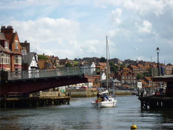 Just one half of the swing bridge open for a yacht.