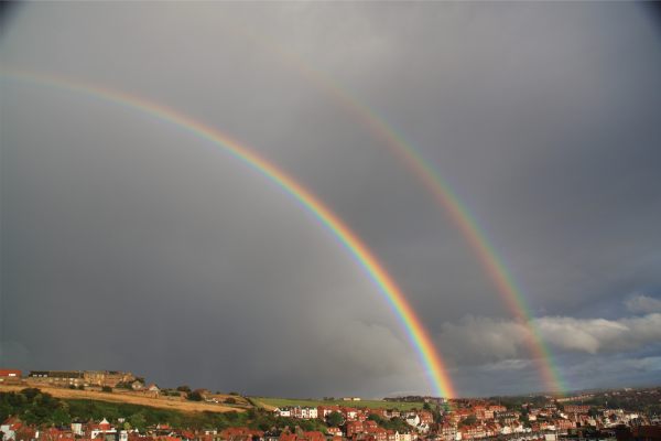 The end of the storm. Taken from the cottage. Two brilliant rainbows against the black clouds.