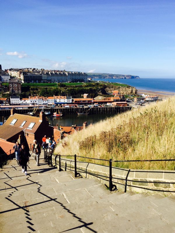 199 down with a glorious view across Whitby Bay. Shallow steps and plenty of seats if you feel puffed.