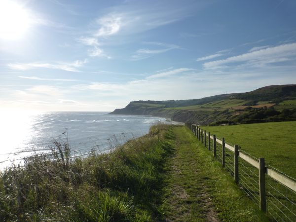 Heading south on a glorious morning with the sun glinting off the water in the bay on the left.