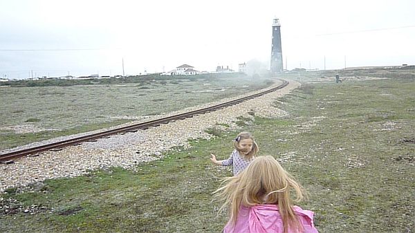 Waving at trains on the Romney Hythe and Dymchurch Railway.